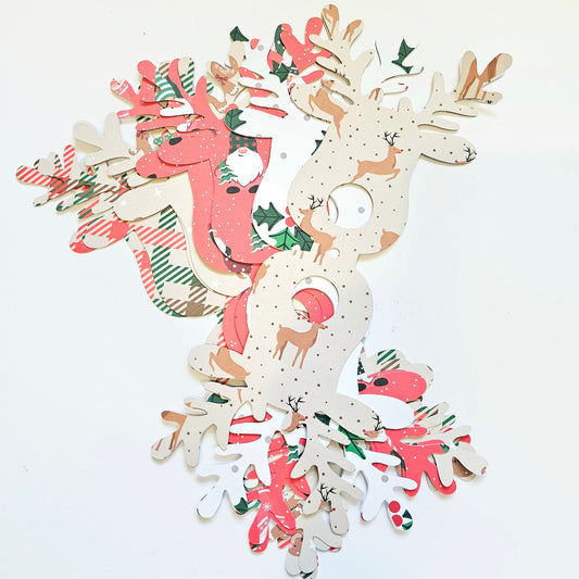 Set of decorative paper reindeer with Christmas patterns on a white background
