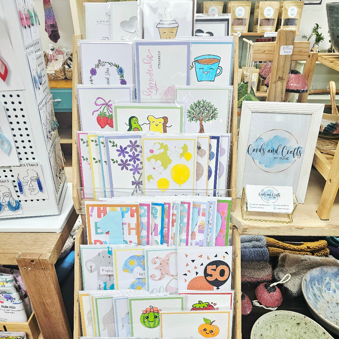 Display of greeting cards and framed prints in a store setting